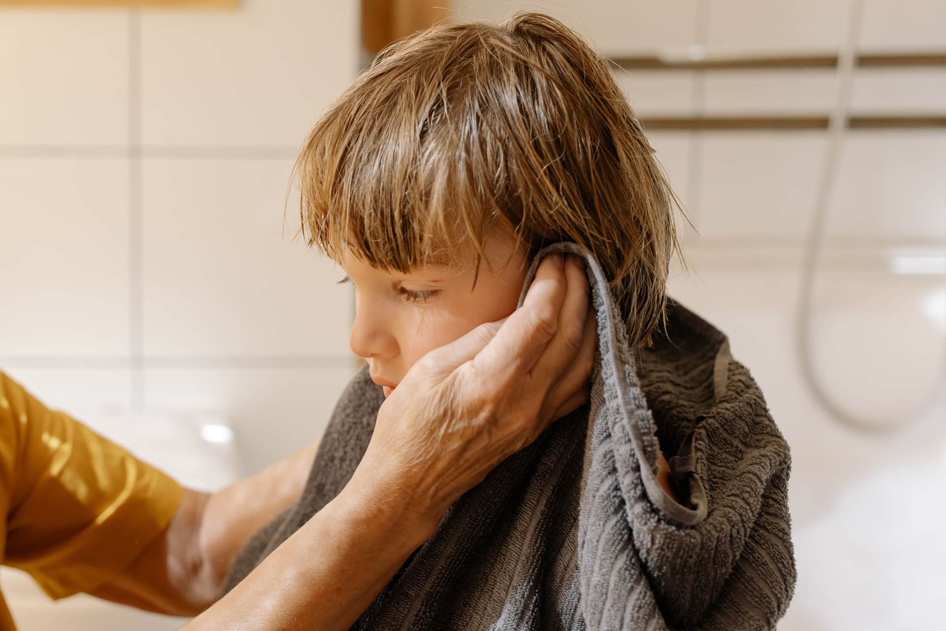 Wet hair being blotted with a towel