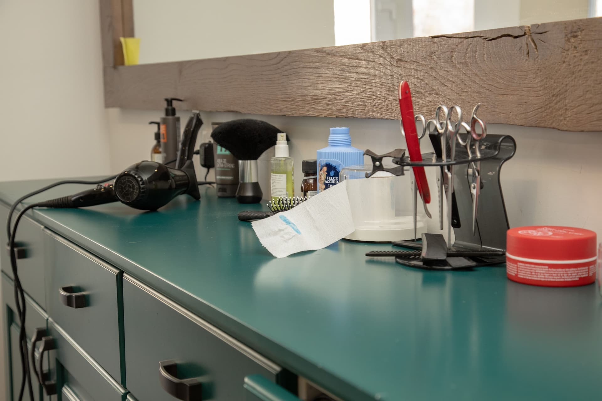 Styling tools resting on a bathroom counter