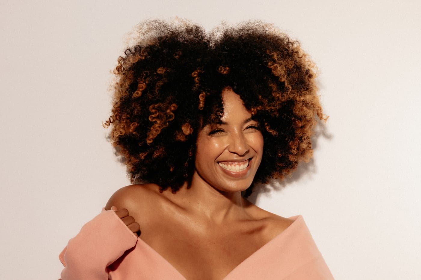 Coily natural hair being styled