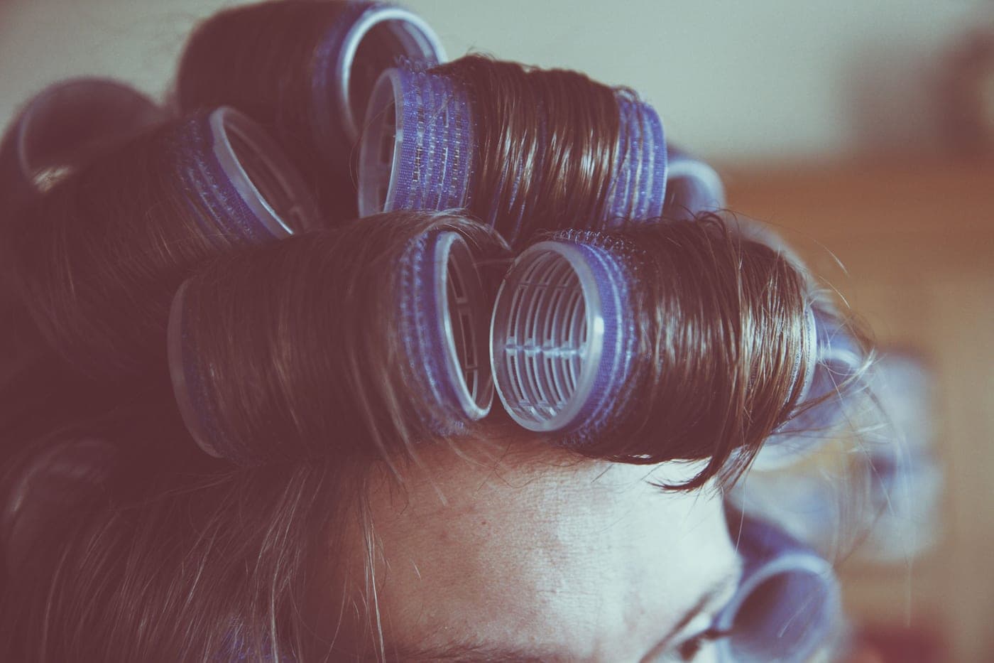 A set of hair rollers arranged on a surface