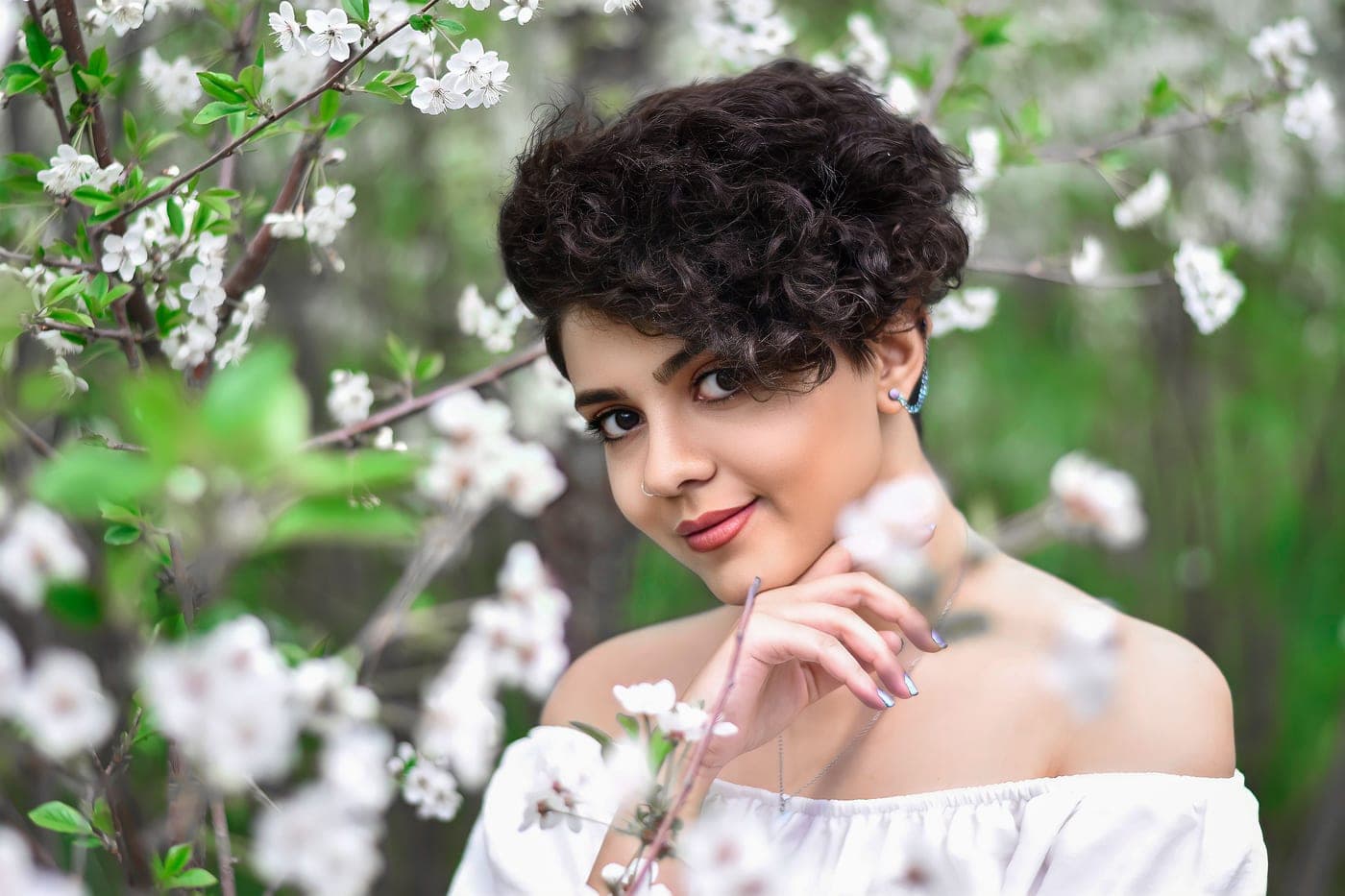 A short layered cut styled with volume at the roots