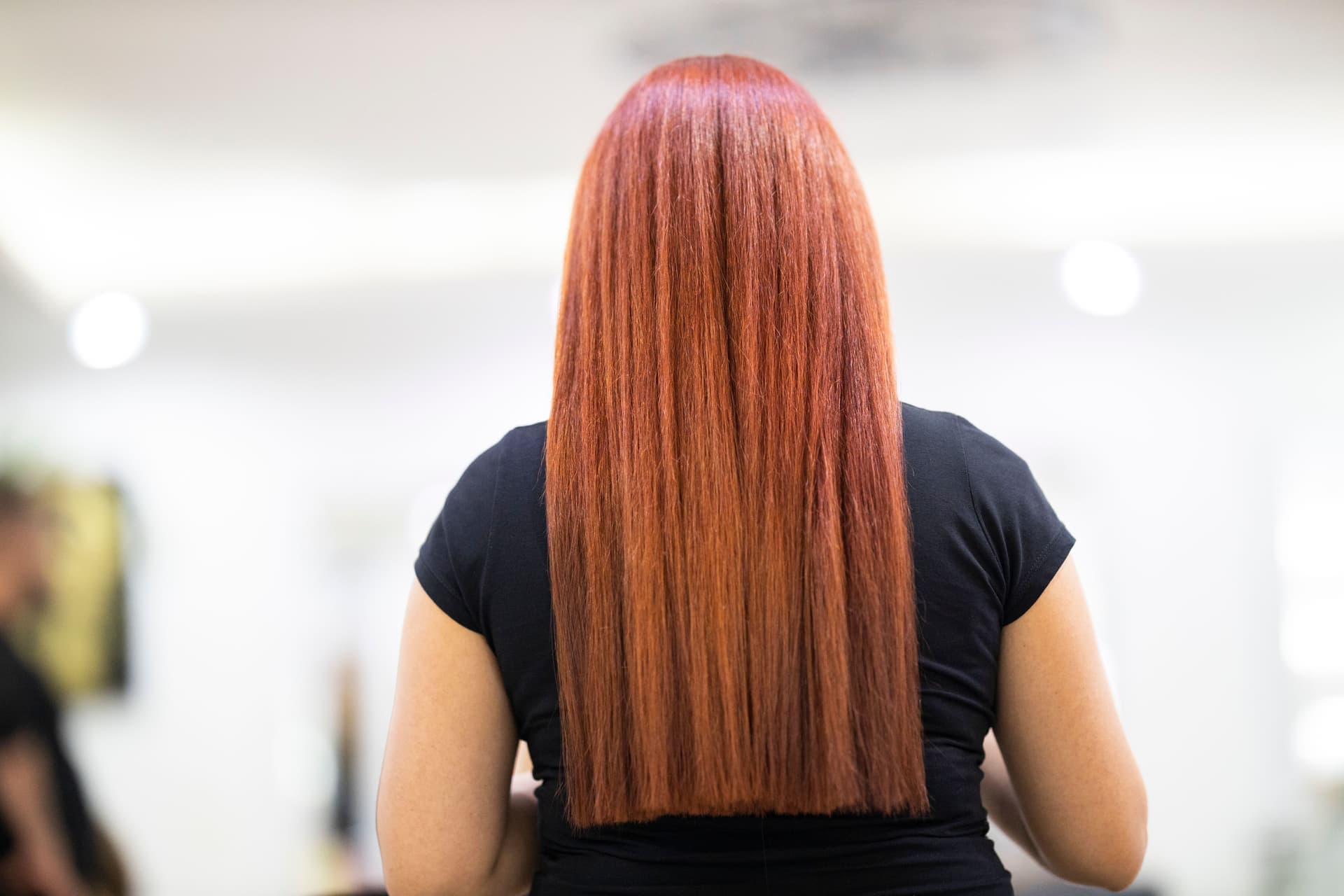 Smooth straightened hair catching daylight