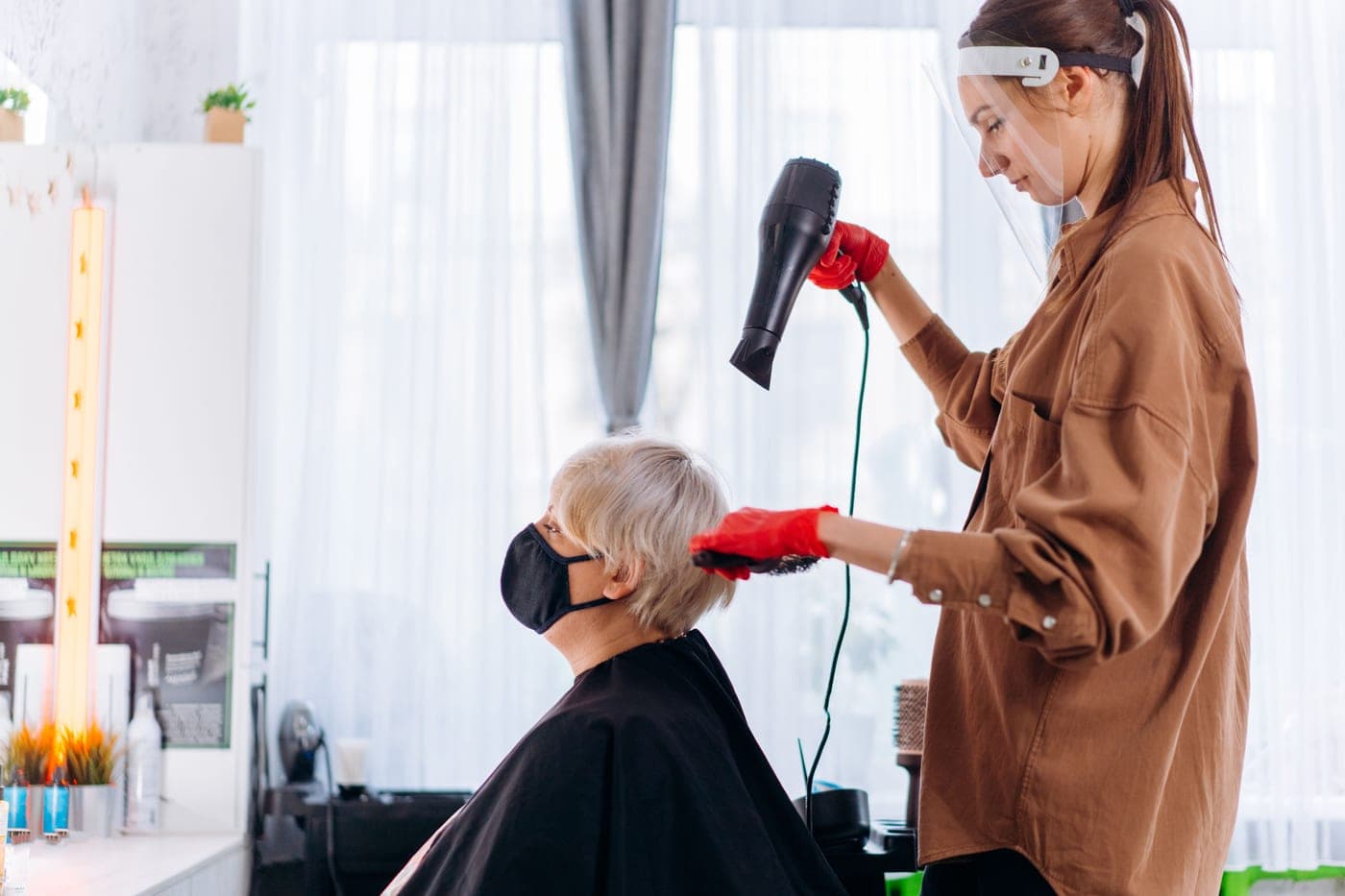 Two hair dryers photographed side by side