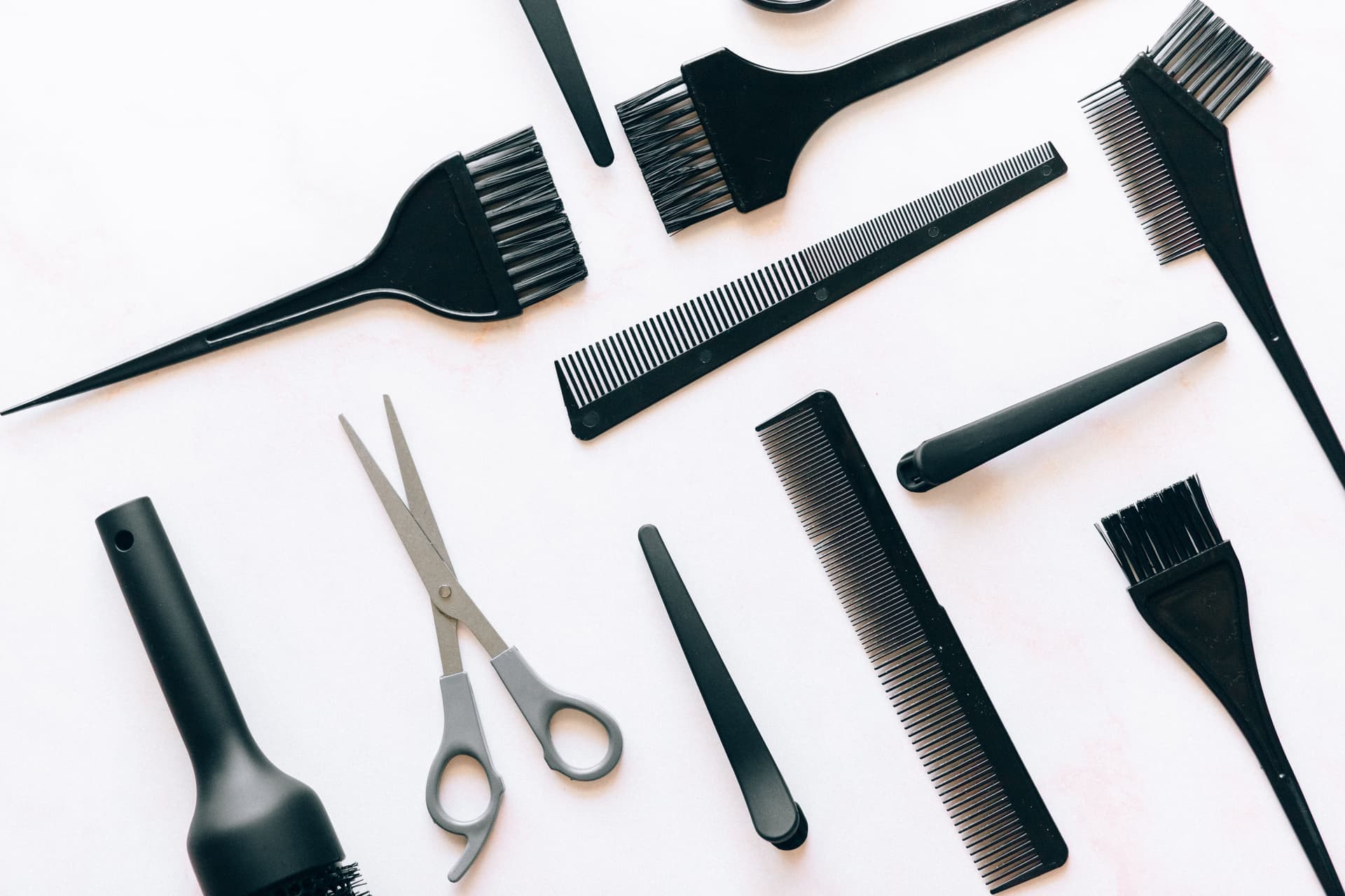 Hair styling tools arranged on a plain surface
